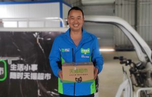 天猫双11百城千校送货上门，200城天猫超市包裹“不上门必赔”